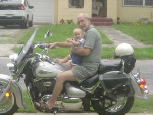 Ryan with Frank on his motorcycle.
