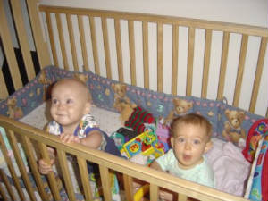 Ryan and Olivia in the crib.