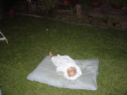 Ryan asleep on the dog bed.