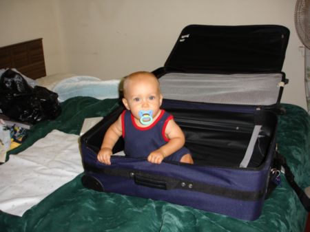 Ryan in a suitcase.