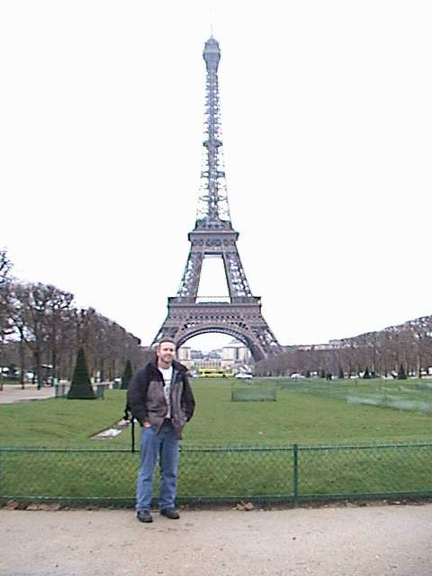 Larry in front of the Eiffel Tower.